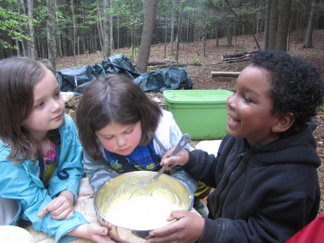 Early this morning in the woods we were making cake for a student's birthday, it turned out well. It was called "Mud Cake," but the mud in the cake was really chocolate. It was yummy. The birthday boy gave it a thumbs up.